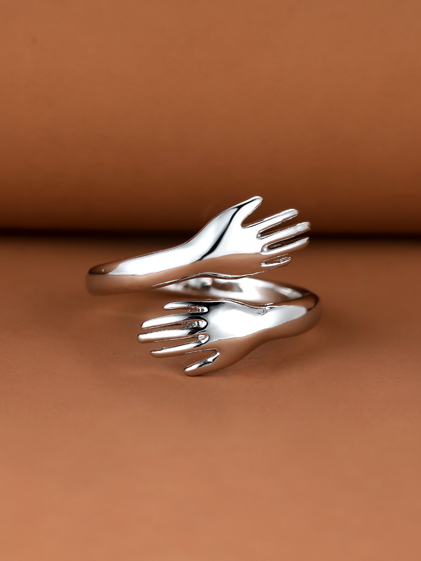 Couples Rings With Palms Spread Wide